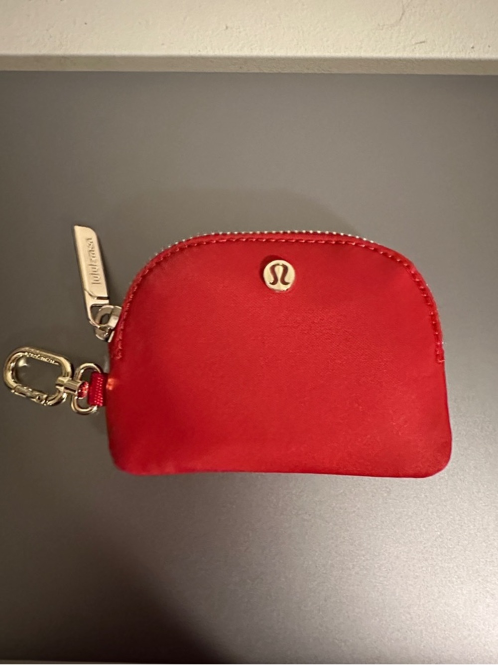 lululemon red key pouch with gold hardware and carabiner